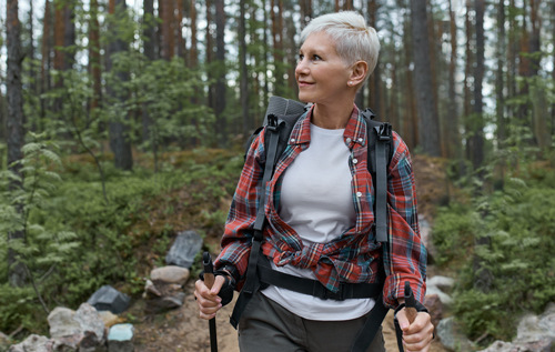 photo of a middle aged woman hiking
