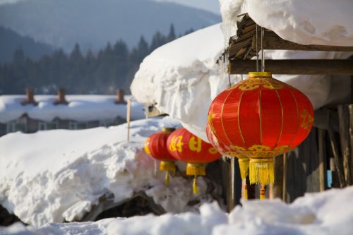 photo of a paper lanters and snow