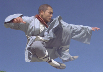 photo of a man in a flying monk pose